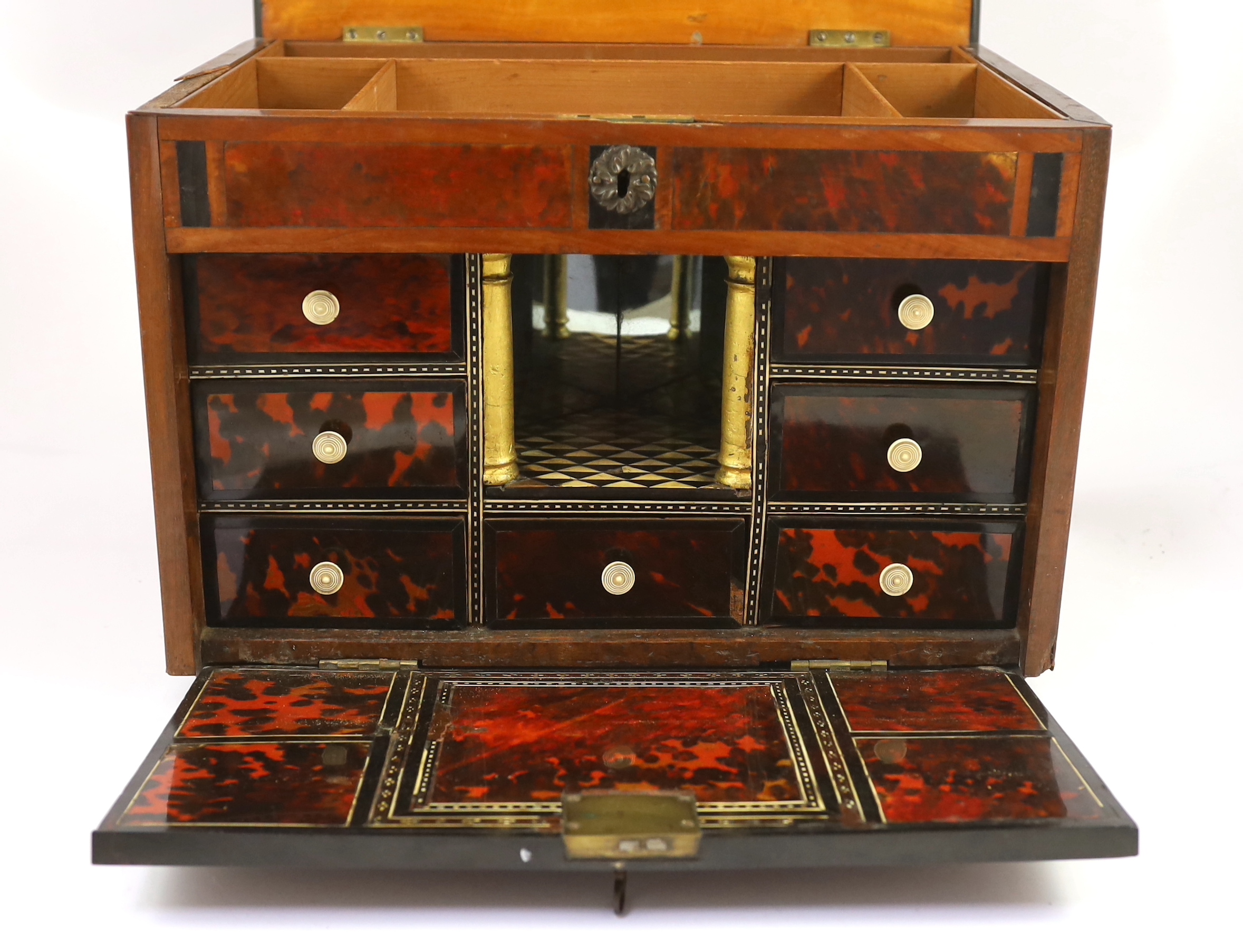 An early 18th century Indo Portuguese ebony, satinwood and red tortoiseshell travelling case, 42cm wide, 30cm deep, 29cm high. Ivory submission reference: YHDD1FSF